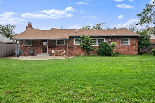 5225 S Toledo Ave, Tulsa, OK 74135 - rear view of house with a patio area, a chimney, brick siding, and a shingled roof