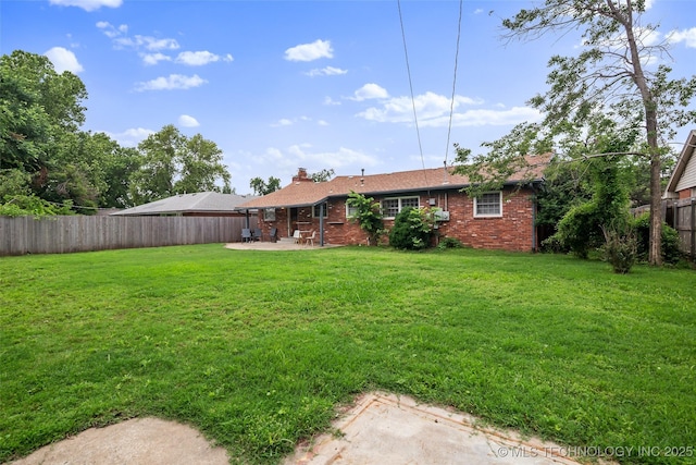 5225 S Toledo Ave, Tulsa, OK 74135 - fenced backyard with a patio