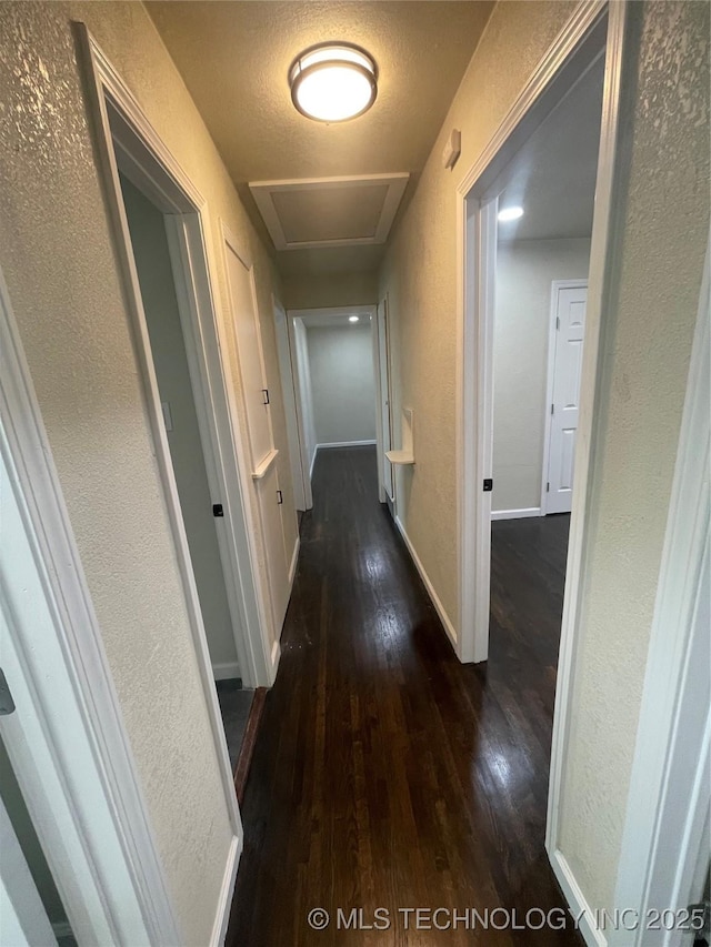 26 E 45th St N, Tulsa, OK 74106 - hallway with a textured wall, hardwood / wood-style flooring, and attic access