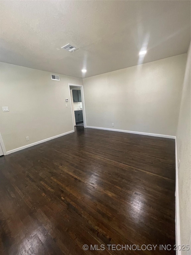 26 E 45th St N, Tulsa, OK 74106 - empty room featuring dark wood-style floors
