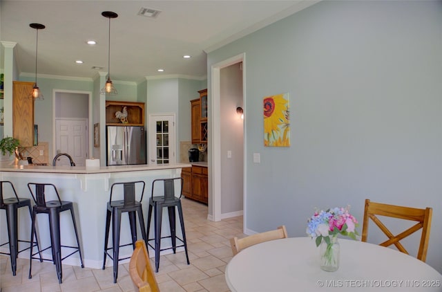 14230 S Urbana Ave, Bixby, OK 74008 - kitchen featuring stainless steel fridge, a kitchen breakfast bar, backsplash, a peninsula, and open shelves