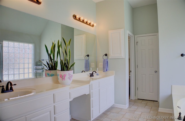 14230 S Urbana Ave, Bixby, OK 74008 - full bathroom featuring double vanity and a tub to relax in
