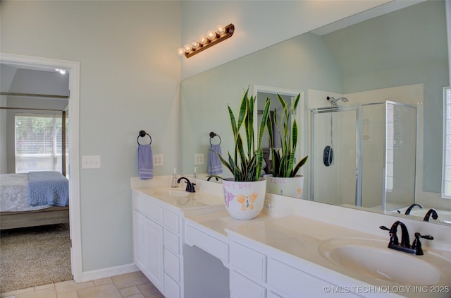 14230 S Urbana Ave, Bixby, OK 74008 - ensuite bathroom featuring double vanity, a shower stall, vaulted ceiling, and tile patterned flooring