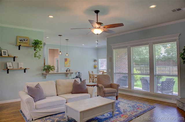 14230 S Urbana Ave, Bixby, OK 74008 - living area featuring a ceiling fan, wood finished floors, recessed lighting, and crown molding