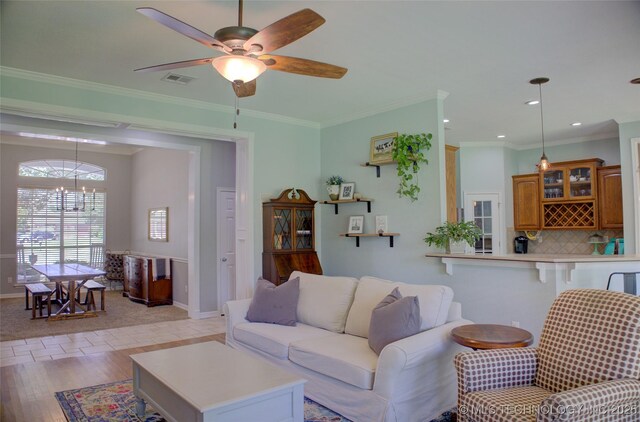 14230 S Urbana Ave, Bixby, OK 74008 - living area featuring light wood-type flooring, a chandelier, a ceiling fan, crown molding, and recessed lighting