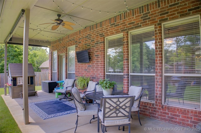 14230 S Urbana Ave, Bixby, OK 74008 - view of patio with ceiling fan and a storage shed