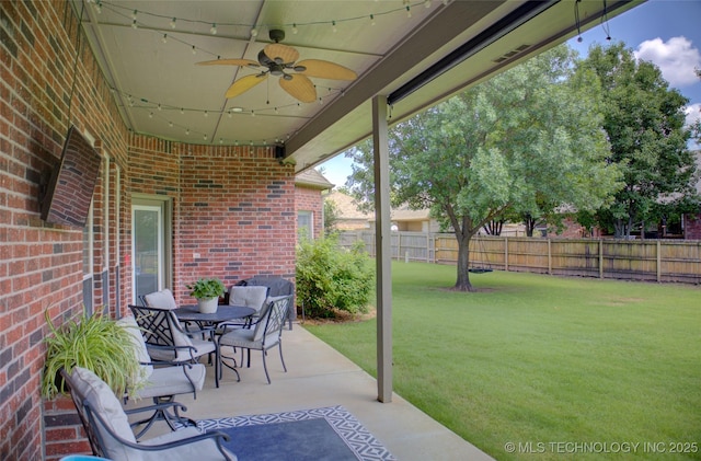 14230 S Urbana Ave, Bixby, OK 74008 - fenced backyard featuring ceiling fan and a patio area