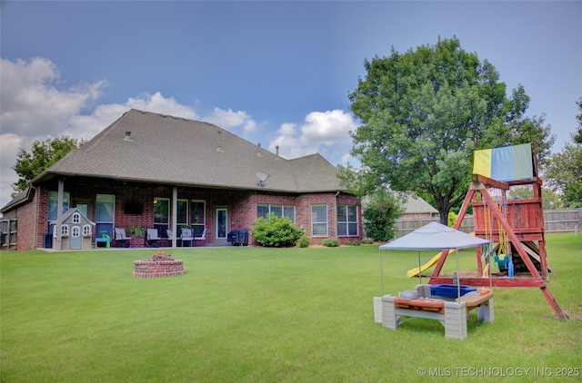 14230 S Urbana Ave, Bixby, OK 74008 - back of property with brick siding, a playground, and roof with shingles
