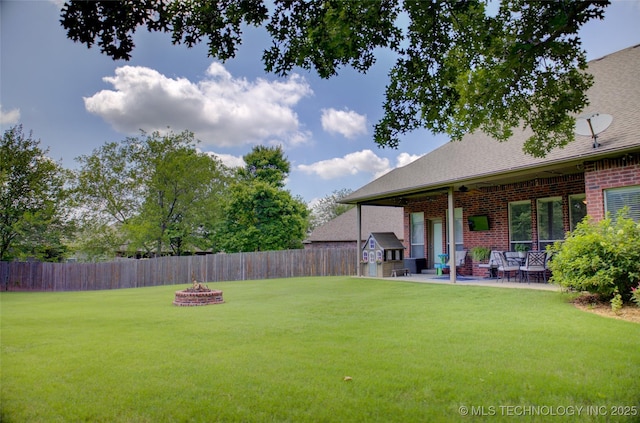 14230 S Urbana Ave, Bixby, OK 74008 - fenced backyard with a fire pit and a patio