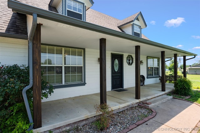 19935 Mountain Ln, Claremore, OK 74019 - entrance to property featuring a porch and a shingled roof