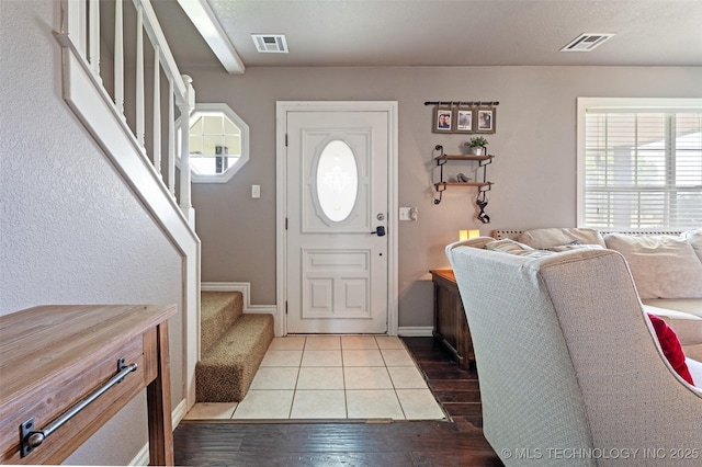 19935 Mountain Ln, Claremore, OK 74019 - foyer entrance featuring hardwood / wood-style flooring, healthy amount of natural light, and stairway