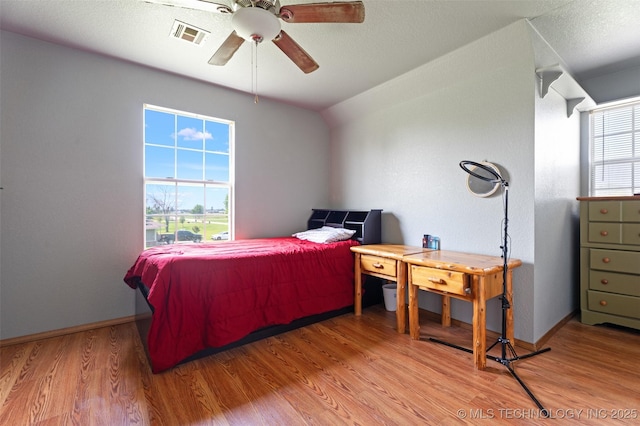 19935 Mountain Ln, Claremore, OK 74019 - bedroom with wood finished floors, a ceiling fan, and vaulted ceiling