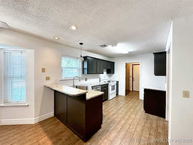 6223 S Cedar Pl, Broken Arrow, OK 74011 - kitchen featuring electric stove, a peninsula, light wood finished floors, a textured ceiling, and light stone counters