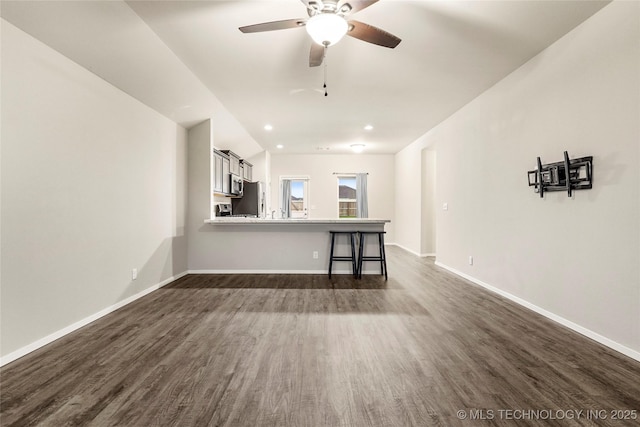23561 E 114th Ct, Broken Arrow, OK 74014 - unfurnished living room with dark wood-style floors, a ceiling fan, and recessed lighting