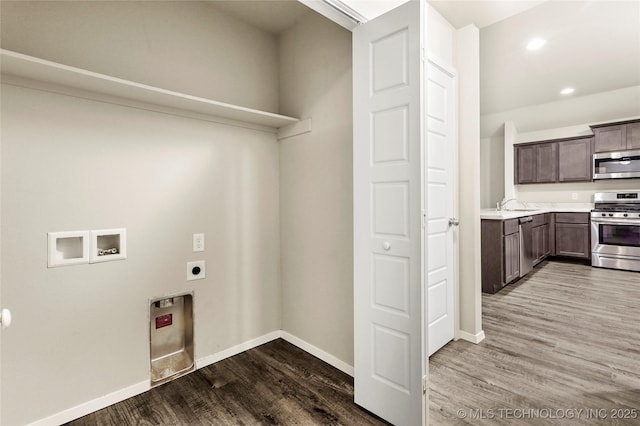 23561 E 114th Ct, Broken Arrow, OK 74014 - washroom with hookup for a washing machine, electric dryer hookup, wood finished floors, and recessed lighting