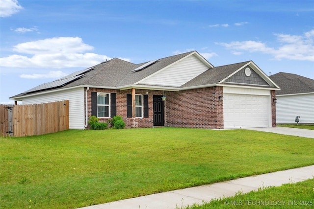 23561 E 114th Ct, Broken Arrow, OK 74014 - view of front facade with an attached garage, brick siding, solar panels, and driveway