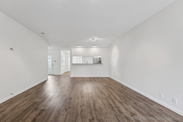 8316 E 81st Pl, Tulsa, OK 74133 - unfurnished living room with dark wood-style flooring and baseboards