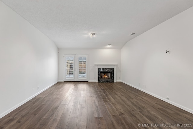 8316 E 81st Pl, Tulsa, OK 74133 - unfurnished living room featuring dark wood-style flooring and a premium fireplace