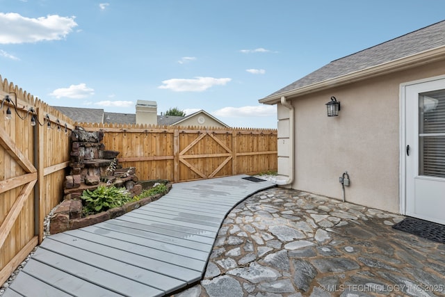 8316 E 81st Pl, Tulsa, OK 74133 - fenced backyard featuring a patio area