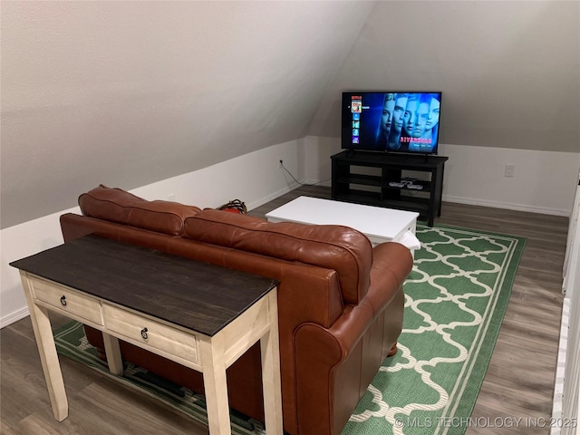 321 E 10th St, Pawhuska, OK 74056 - living area featuring vaulted ceiling and wood finished floors
