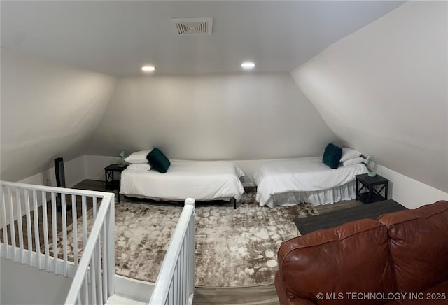 321 E 10th St, Pawhuska, OK 74056 - bedroom with wood finished floors, lofted ceiling, and recessed lighting