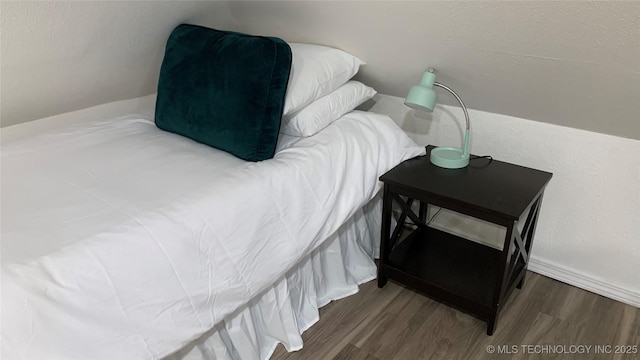 321 E 10th St, Pawhuska, OK 74056 - bedroom featuring wood finished floors
