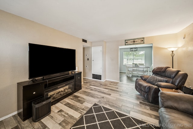 13728 S Birch St, Glenpool, OK 74033 - living room featuring wood finished floors and baseboards