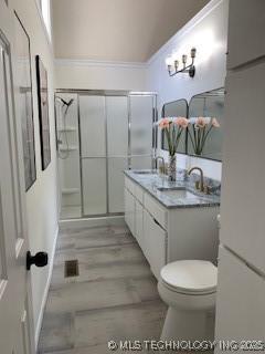 4822 S Quaker Ave, Tulsa, OK 74105 - full bath featuring double vanity and a shower stall