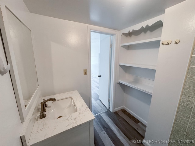 916 Coy Ave, Tahlequah, OK 74464 - bathroom featuring vanity and wood finished floors