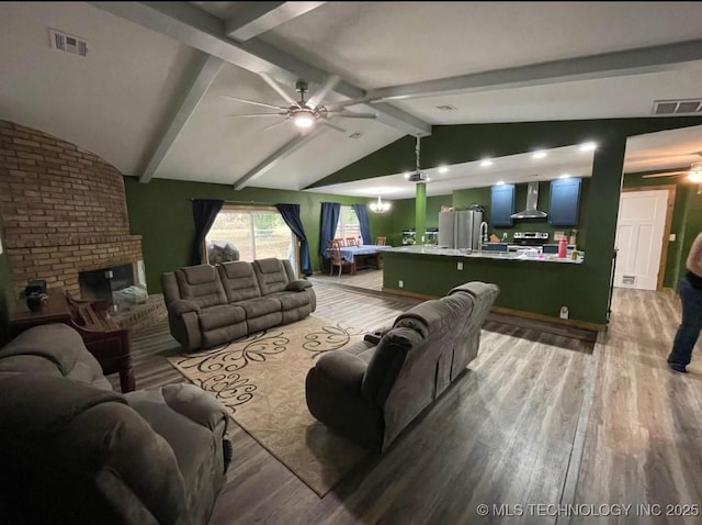 23422 E 79th St S, Broken Arrow, OK 74014 - living area with ceiling fan, wood finished floors, and a fireplace