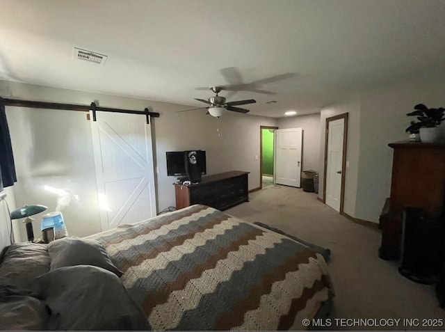 23422 E 79th St S, Broken Arrow, OK 74014 - bedroom featuring a barn door, light colored carpet, and ceiling fan