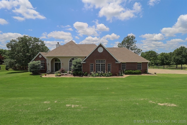 12310 S Mesa Rd, Sapulpa, OK 74066 - view of front of property with a front yard, a chimney, and brick siding