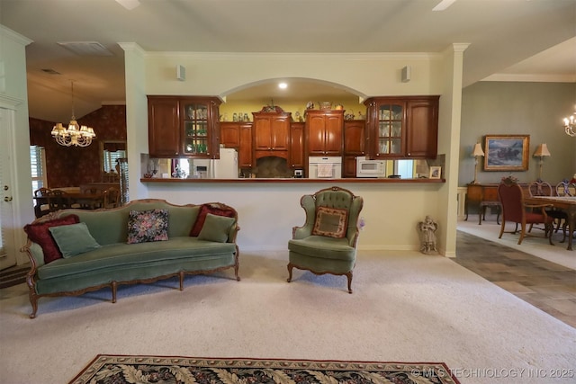 12310 S Mesa Rd, Sapulpa, OK 74066 - carpeted living area featuring a chandelier, crown molding, and arched walkways