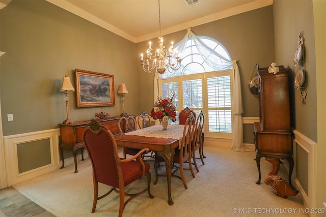 12310 S Mesa Rd, Sapulpa, OK 74066 - dining area featuring ornamental molding, a chandelier, light carpet, and a wainscoted wall