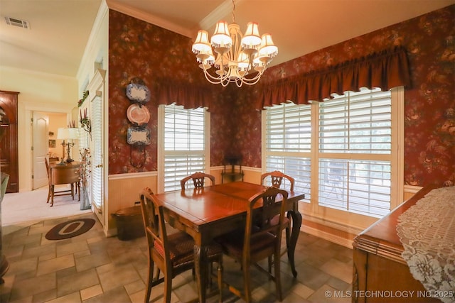 12310 S Mesa Rd, Sapulpa, OK 74066 - dining area with wallpapered walls, wainscoting, a chandelier, stone finish floors, and ornamental molding