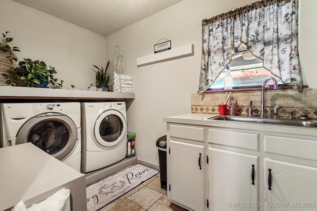 4152 W Oak St, Skiatook, OK 74070 - laundry area featuring separate washer and dryer, light tile patterned flooring, and cabinet space