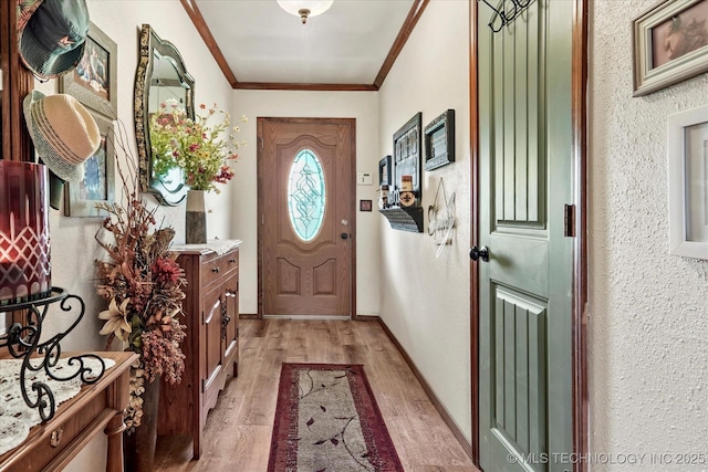 4152 W Oak St, Skiatook, OK 74070 - entrance foyer with light wood-style flooring, ornamental molding, and a textured wall