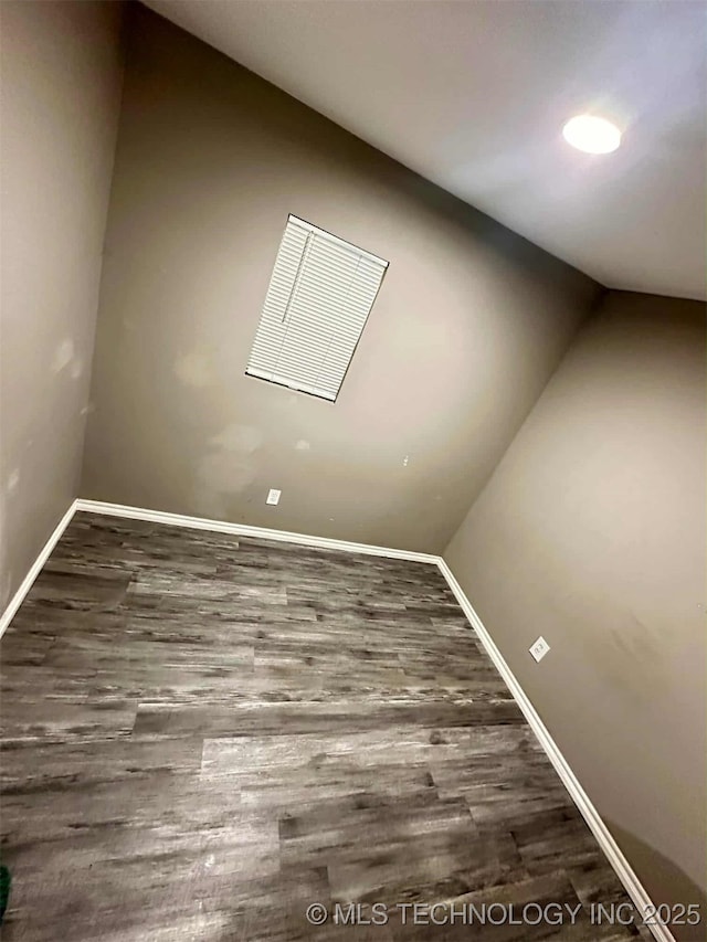 1026 N Utica Ave, Tulsa, OK 74110 - spare room featuring wood finished floors and lofted ceiling