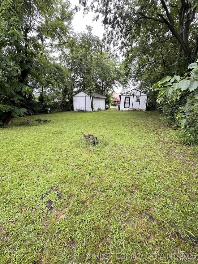 1026 N Utica Ave, Tulsa, OK 74110 - view of green lawn with a storage unit