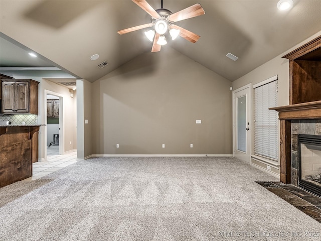 4667 E 144th Pl S, Bixby, OK 74008 - unfurnished living room featuring light carpet, a fireplace, a ceiling fan, vaulted ceiling, and recessed lighting