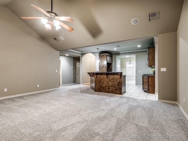 4667 E 144th Pl S, Bixby, OK 74008 - unfurnished living room featuring light carpet, arched walkways, a ceiling fan, recessed lighting, and high vaulted ceiling