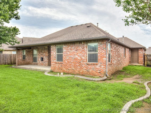 4667 E 144th Pl S, Bixby, OK 74008 - back of property with a shingled roof, a patio, and brick siding