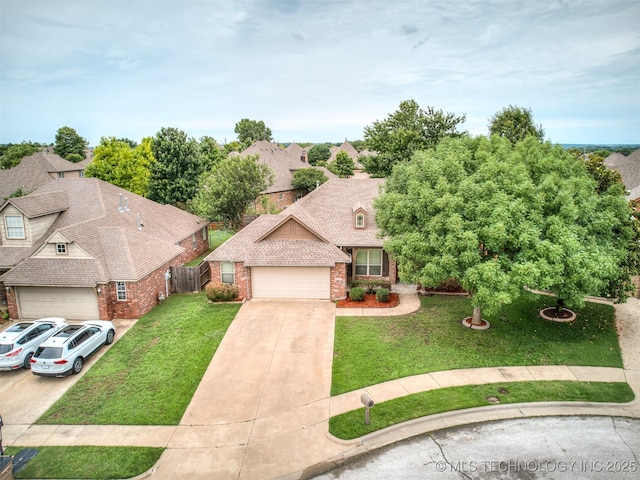 4667 E 144th Pl S, Bixby, OK 74008 - view of front of house with brick siding, driveway, a garage, and a shingled roof