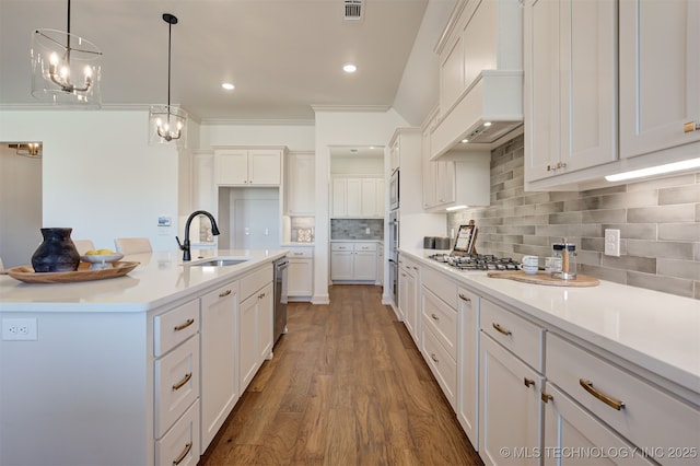 1416 N 71st St, Broken Arrow, OK 74014 - kitchen with white cabinets, wood finished floors, tasteful backsplash, light countertops, and recessed lighting