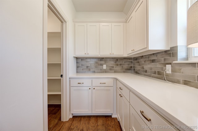 1416 N 71st St, Broken Arrow, OK 74014 - kitchen with white cabinetry, dark wood finished floors, backsplash, and light countertops