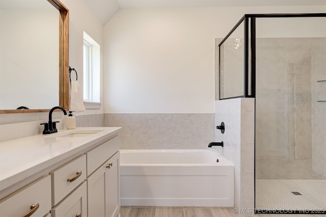 1416 N 71st St, Broken Arrow, OK 74014 - full bathroom with a garden tub, vanity, a tile shower, lofted ceiling, and wood finished floors