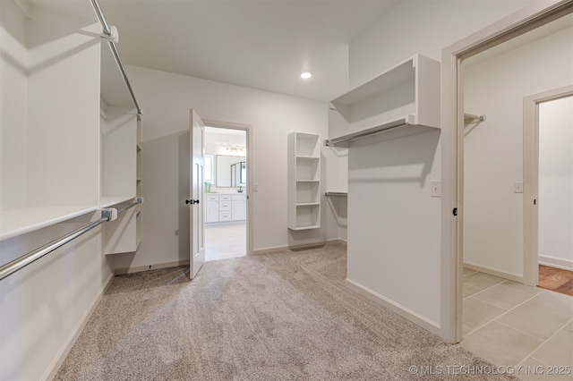 1416 N 71st St, Broken Arrow, OK 74014 - walk in closet featuring light colored carpet