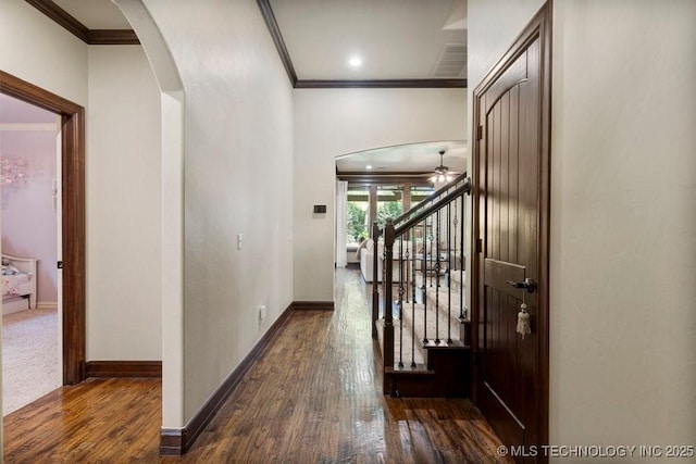 2015 W 109th St, Jenks, OK 74037 - hallway with ornamental molding, arched walkways, wood finished floors, and stairway
