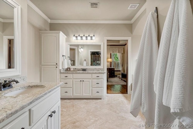 2015 W 109th St, Jenks, OK 74037 - ensuite bathroom featuring ornamental molding, two vanities, and tile patterned flooring