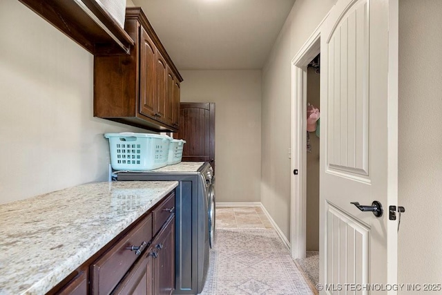 2015 W 109th St, Jenks, OK 74037 - laundry area featuring washer and clothes dryer, cabinet space, and light tile patterned floors